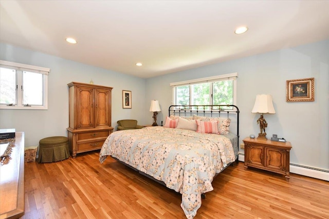2783 Rita Ct, Bellmore, NY 11710 - bedroom featuring light wood finished floors, recessed lighting, baseboard heating, and a baseboard radiator