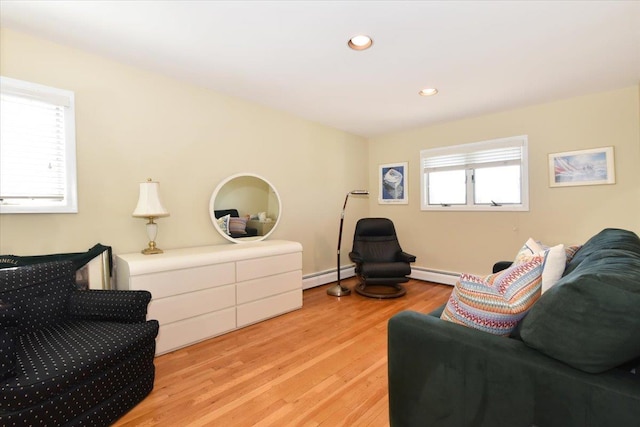 2783 Rita Ct, Bellmore, NY 11710 - living area featuring a baseboard heating unit, light wood finished floors, and recessed lighting