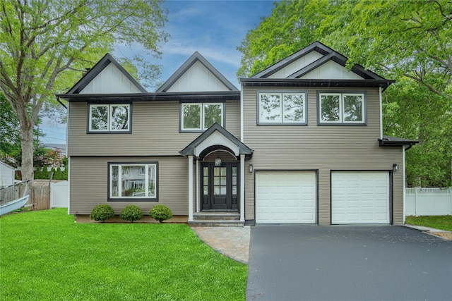 153 Cornell Dr, Commack, NY 11725 - view of front facade featuring driveway, a garage, and board and batten siding