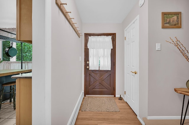 37 Scenic Cir, Croton-On-Hudson, NY 10520 - doorway featuring light wood-style flooring and a baseboard heating unit