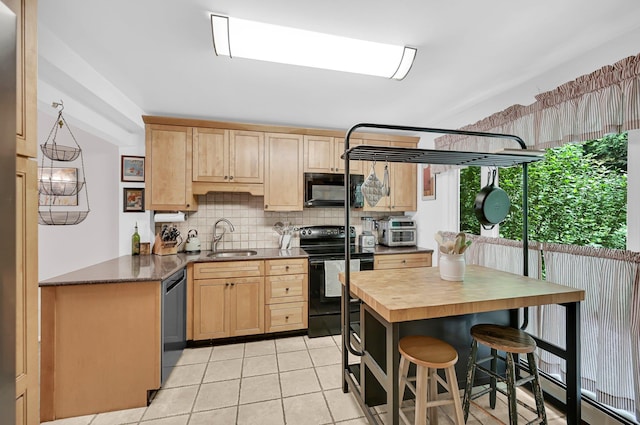 37 Scenic Cir, Croton-On-Hudson, NY 10520 - kitchen with black appliances, decorative backsplash, wooden counters, light tile patterned floors, and light brown cabinetry