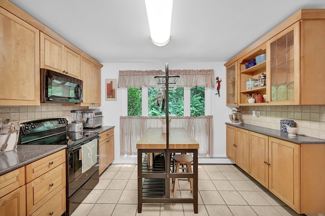 37 Scenic Cir, Croton-On-Hudson, NY 10520 - kitchen featuring black appliances, dark countertops, tasteful backsplash, and light tile patterned floors