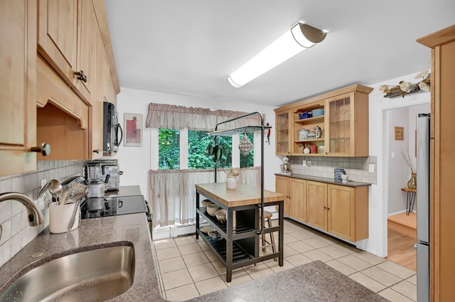 37 Scenic Cir, Croton-On-Hudson, NY 10520 - kitchen with backsplash, light tile patterned flooring, black microwave, open shelves, and freestanding refrigerator