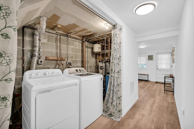 37 Scenic Cir, Croton-On-Hudson, NY 10520 - laundry area featuring washing machine and dryer and wood finished floors