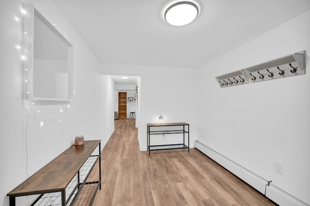 37 Scenic Cir, Croton-On-Hudson, NY 10520 - corridor featuring a baseboard heating unit and wood finished floors