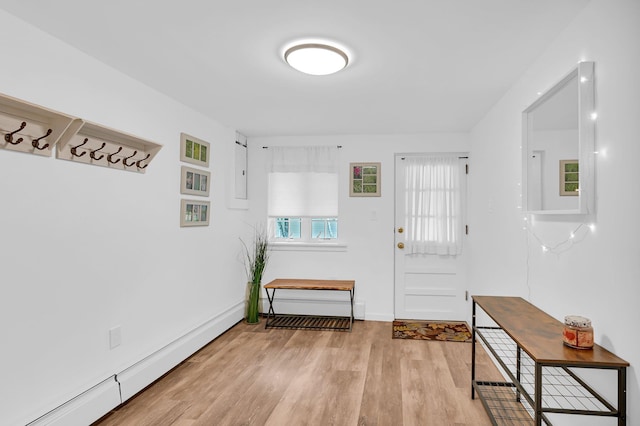 37 Scenic Cir, Croton-On-Hudson, NY 10520 - doorway to outside featuring a baseboard radiator and light wood-style flooring