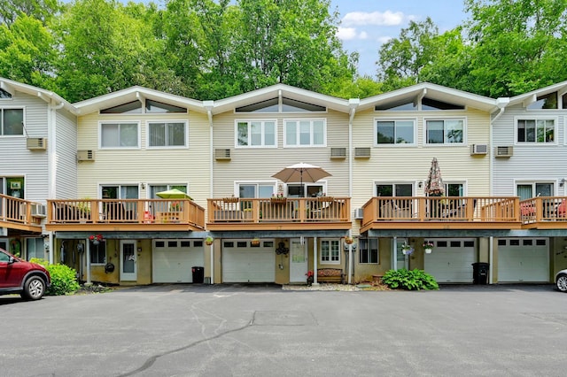 37 Scenic Cir, Croton-On-Hudson, NY 10520 - rear view of property featuring an attached garage and driveway