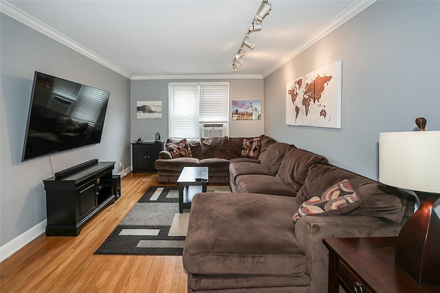 200 N Village Ave Unit D5, Rockville Centre, NY 11570 - living room featuring ornamental molding, light wood finished floors, track lighting, baseboards, and cooling unit