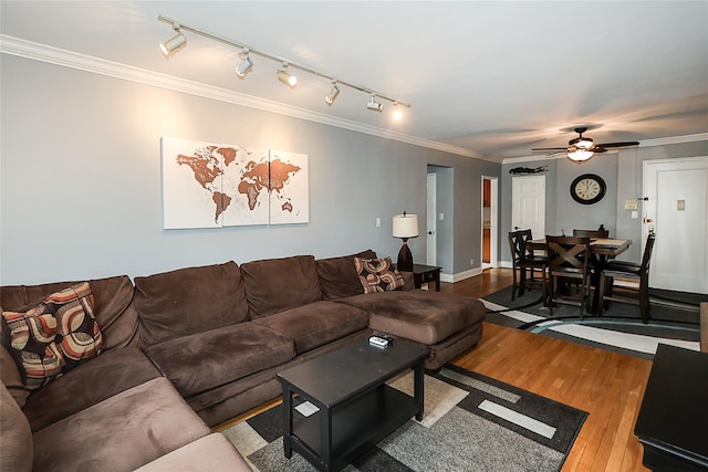 200 N Village Ave Unit D5, Rockville Centre, NY 11570 - living room with wood finished floors, crown molding, ceiling fan, and rail lighting