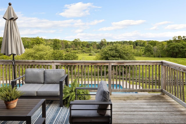 62 Hicks Ln, Clinton Corners, NY 12514 - deck with outdoor lounge area, an outdoor pool, and a view of trees