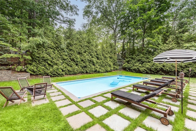 21 Hillside Dr W, Sag Harbor, NY 11963 - swimming pool featuring an outdoor fire pit, a lawn, and a patio