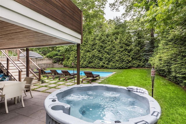 21 Hillside Dr W, Sag Harbor, NY 11963 - swimming pool featuring a patio area, stairs, a hot tub, a lawn, and outdoor dining space