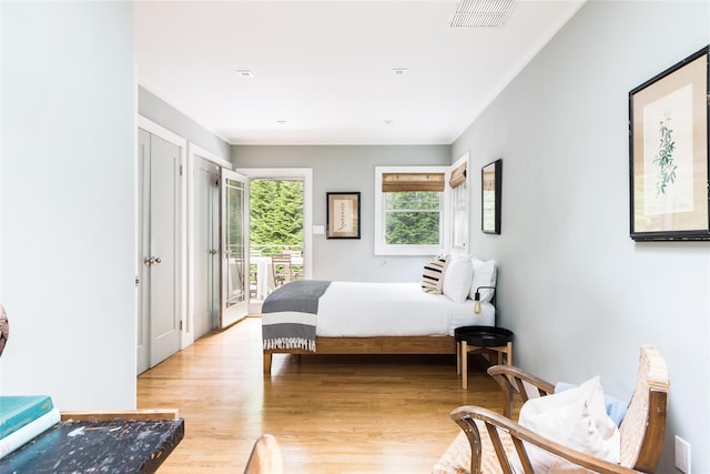 21 Hillside Dr W, Sag Harbor, NY 11963 - bedroom featuring access to outside and light wood-style floors
