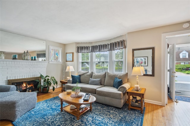 1515 Kenneth Ave, Baldwin, NY 11510 - living room with hardwood / wood-style floors, a fireplace, and baseboards