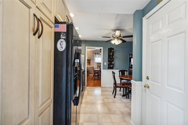 1515 Kenneth Ave, Baldwin, NY 11510 - kitchen with black refrigerator with ice dispenser, ceiling fan, recessed lighting, and a wainscoted wall