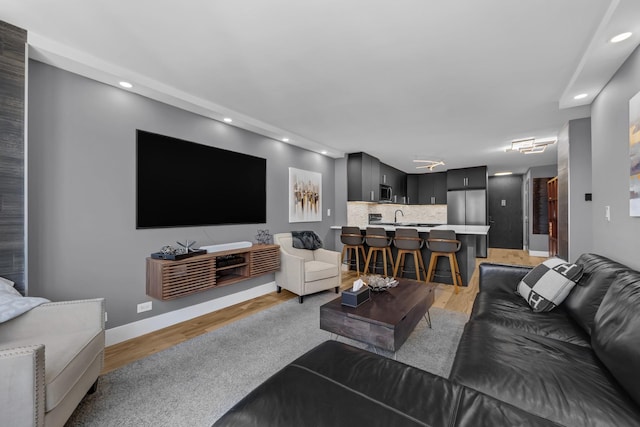 345 E 93rd St Unit 25Ak, New York Manhattan, NY 10128 - living room featuring recessed lighting, baseboards, and light wood-style flooring