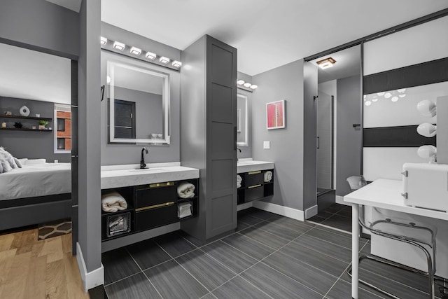345 E 93rd St Unit 25Ak, New York Manhattan, NY 10128 - full bath featuring two vanities, a stall shower, ensuite bathroom, and baseboards