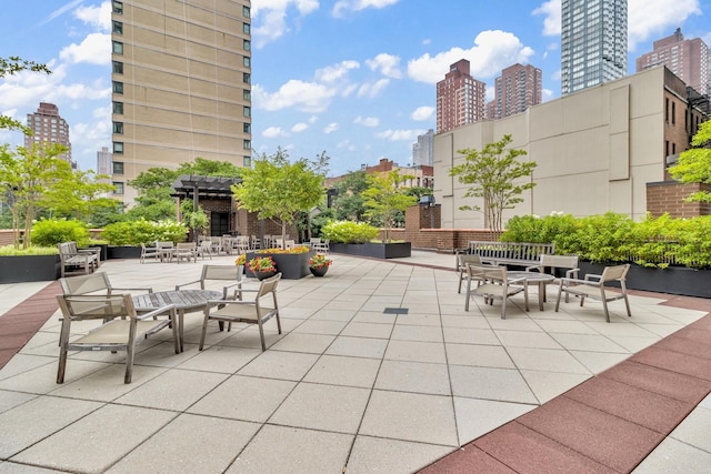 345 E 93rd St Unit 25Ak, New York Manhattan, NY 10128 - view of patio with a view of city and a pergola