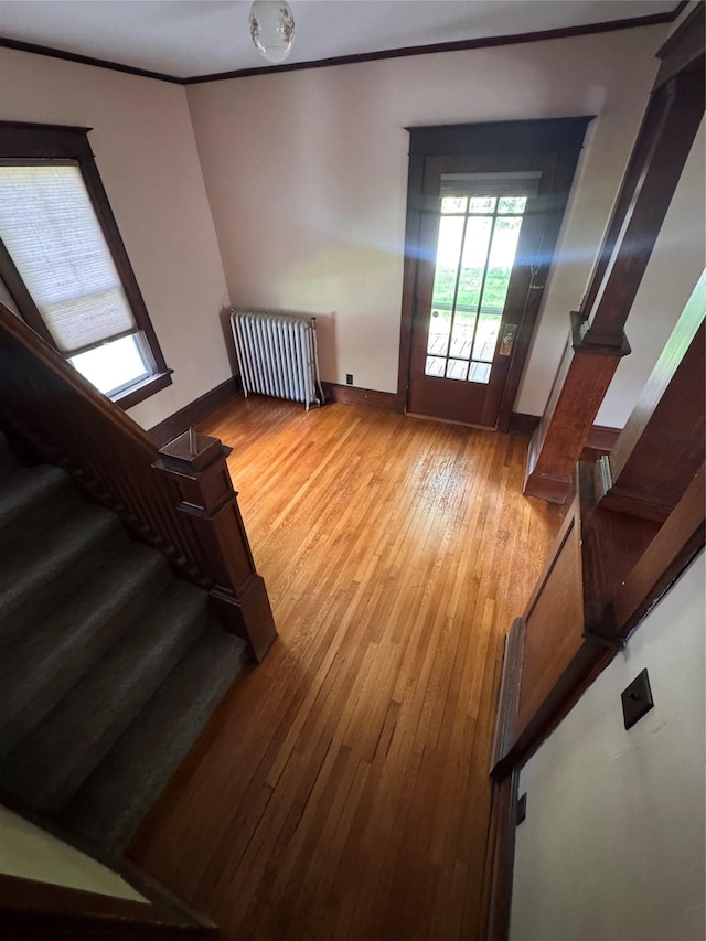 1234 State Route 17k, Montgomery, NY 12549 - stairway featuring radiator, hardwood / wood-style flooring, crown molding, and baseboards
