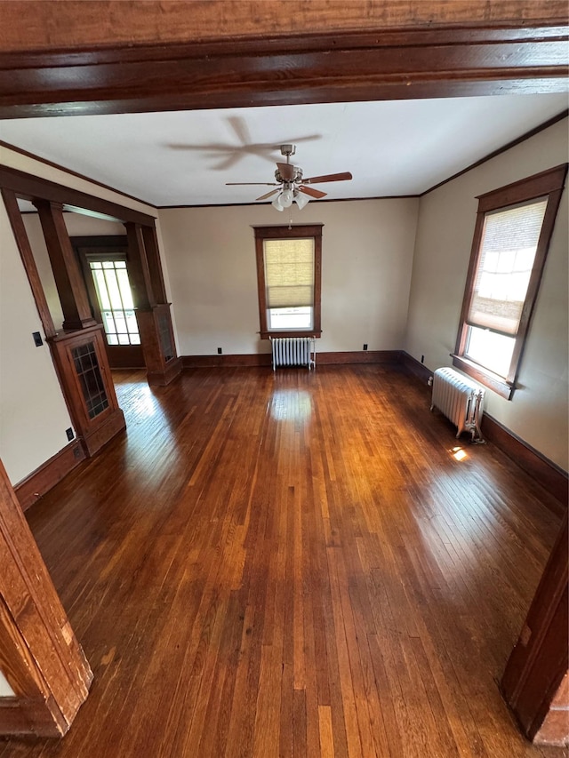 1234 State Route 17k, Montgomery, NY 12549 - empty room featuring radiator heating unit, plenty of natural light, and dark wood-style floors
