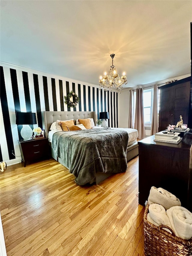 315 King St Unit 6H, Port Chester, NY 10573 - bedroom featuring a chandelier and light wood finished floors