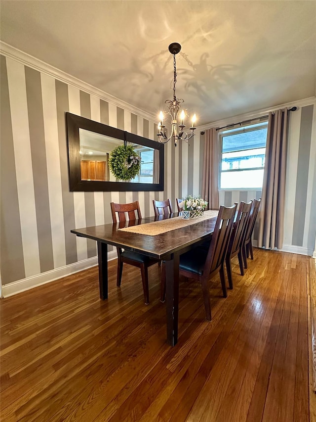 315 King St Unit 6H, Port Chester, NY 10573 - dining space with wallpapered walls, a chandelier, hardwood / wood-style flooring, crown molding, and baseboards
