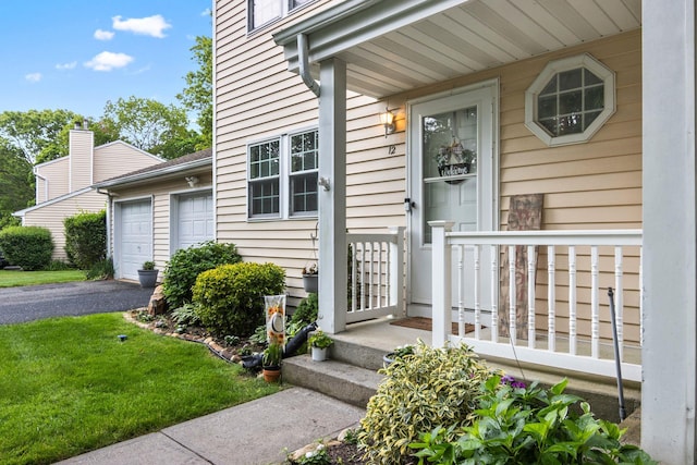12 Franklin Commons, Yaphank, NY 11980 - entrance to property with asphalt driveway and a garage