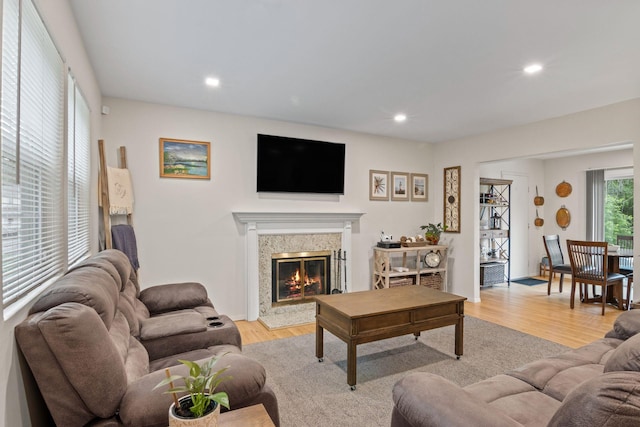 12 Franklin Commons, Yaphank, NY 11980 - living room featuring wood finished floors, a high end fireplace, and recessed lighting