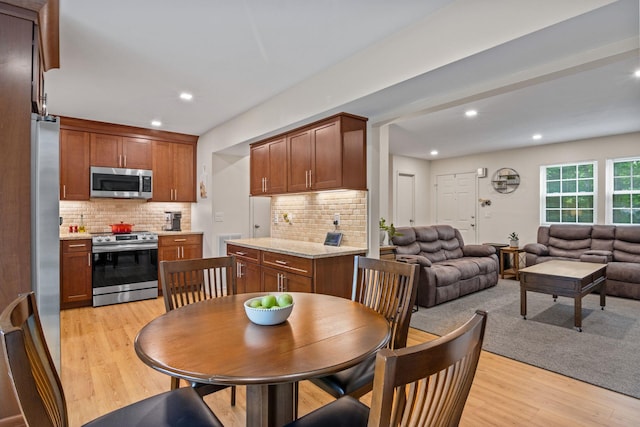 12 Franklin Commons, Yaphank, NY 11980 - dining space with light wood-style floors and recessed lighting