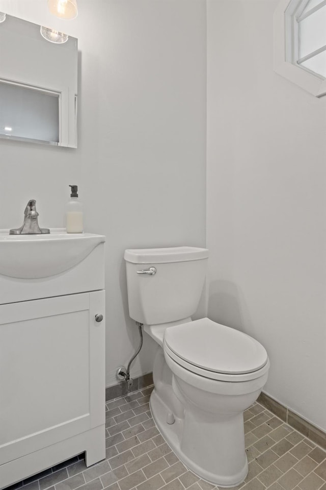 12 Franklin Commons, Yaphank, NY 11980 - half bath with toilet, baseboards, vanity, and tile patterned flooring