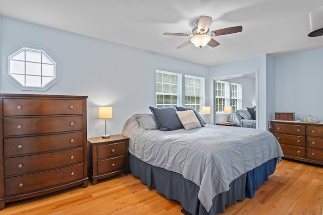 12 Franklin Commons, Yaphank, NY 11980 - bedroom featuring light wood finished floors and a ceiling fan