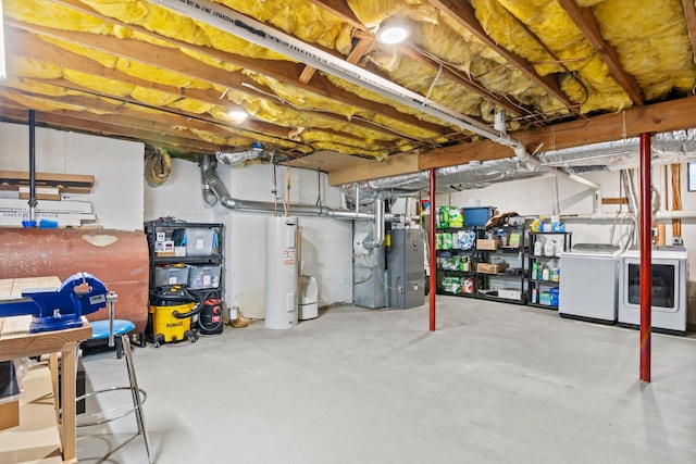 12 Franklin Commons, Yaphank, NY 11980 - unfinished below grade area featuring washing machine and clothes dryer, electric water heater, heating unit, and heating fuel