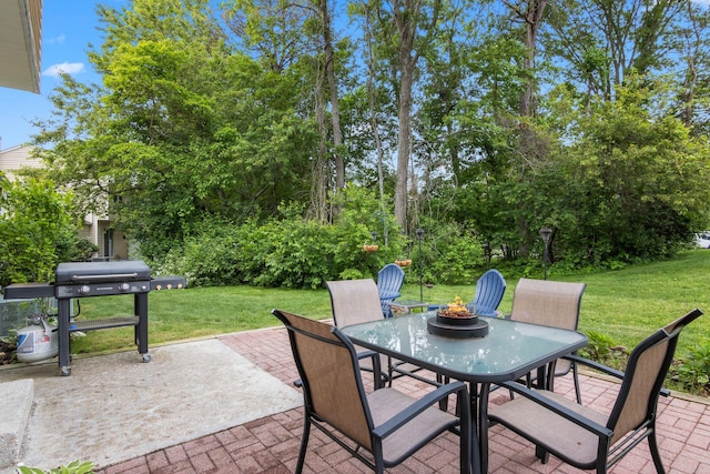 12 Franklin Commons, Yaphank, NY 11980 - view of patio featuring grilling area, outdoor dining area, and a fire pit
