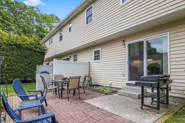 12 Franklin Commons, Yaphank, NY 11980 - view of patio featuring outdoor dining space and entry steps