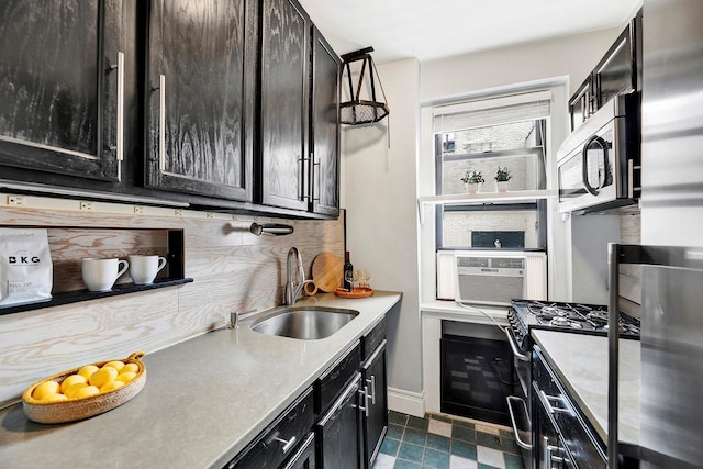 50 Lefferts Ave Unit 6M, Brooklyn, NY 11225 - kitchen with stainless steel appliances, a sink, tasteful backsplash, baseboards, and light countertops