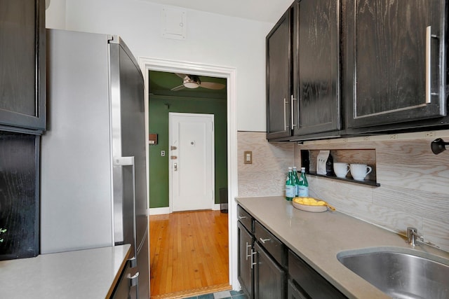 50 Lefferts Ave Unit 6M, Brooklyn, NY 11225 - kitchen with freestanding refrigerator, dark brown cabinets, a sink, and light countertops
