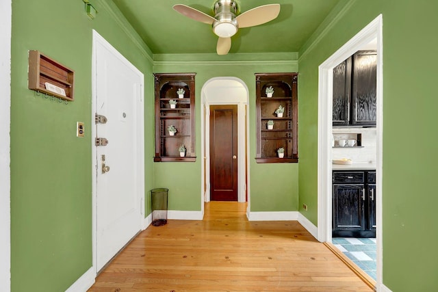 50 Lefferts Ave Unit 6M, Brooklyn, NY 11225 - foyer featuring light wood-style flooring, ceiling fan, ornamental molding, baseboards, and arched walkways