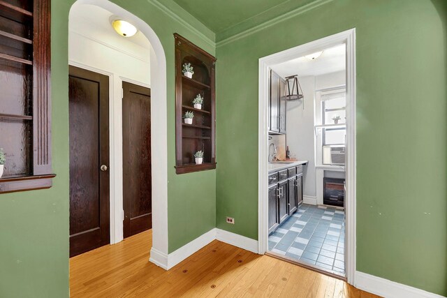 50 Lefferts Ave Unit 6M, Brooklyn, NY 11225 - hall with light wood finished floors, ornamental molding, a sink, baseboards, and cooling unit