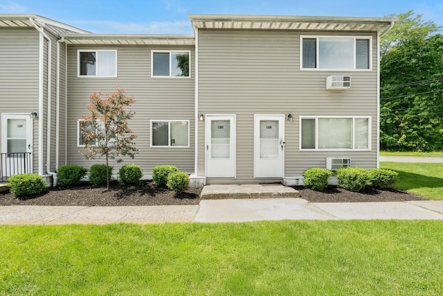 10 Fishkill Glen Dr Unit G, Fishkill, NY 12524 - view of property with a front lawn and a wall mounted AC