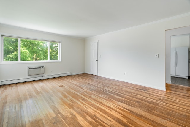 10 Fishkill Glen Dr Unit G, Fishkill, NY 12524 - unfurnished room with light wood-style flooring, ornamental molding, baseboard heating, baseboards, and a wall mounted air conditioner