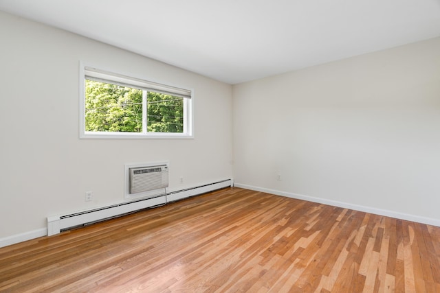 10 Fishkill Glen Dr Unit G, Fishkill, NY 12524 - spare room featuring baseboard heating, light wood-style flooring, baseboards, and a wall mounted AC