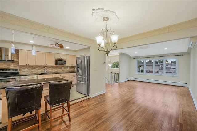4 Mason Ct, Levittown, NY 11756 - kitchen with stainless steel appliances, extractor fan, a baseboard radiator, dark countertops, and backsplash