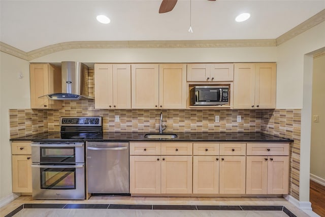 4 Mason Ct, Levittown, NY 11756 - kitchen featuring appliances with stainless steel finishes, wall chimney range hood, a sink, light brown cabinets, and baseboards