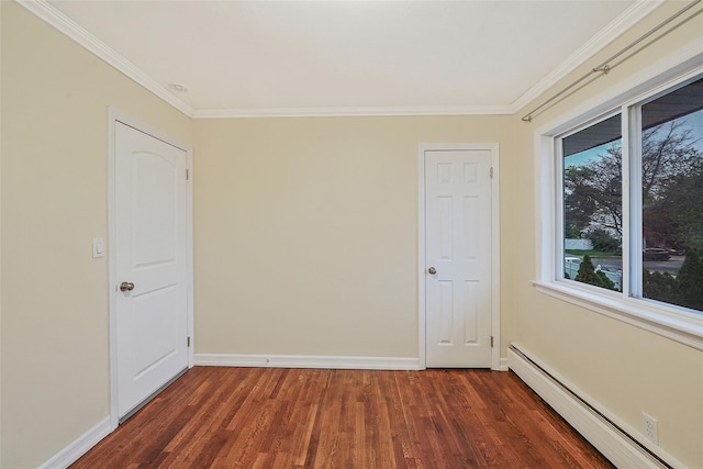 4 Mason Ct, Levittown, NY 11756 - empty room with baseboard heating, wood finished floors, crown molding, and baseboards