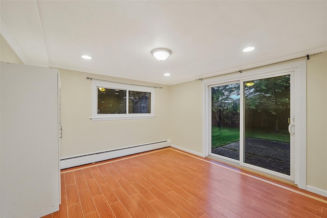 4 Mason Ct, Levittown, NY 11756 - spare room featuring baseboard heating, baseboards, wood finished floors, and recessed lighting