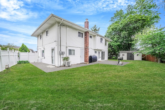 4 Mason Ct, Levittown, NY 11756 - rear view of house with a chimney, a patio area, cooling unit, and gravel driveway