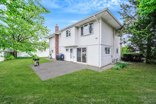 4 Mason Ct, Levittown, NY 11756 - back of house featuring a chimney, a patio, and heating fuel