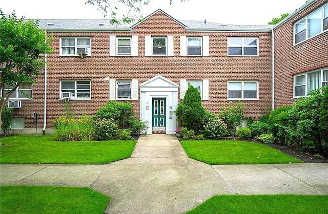 89-25 Shore Pkwy Unit 1L, Howard Beach, NY 11414 - view of property with brick siding, a front lawn, and cooling unit