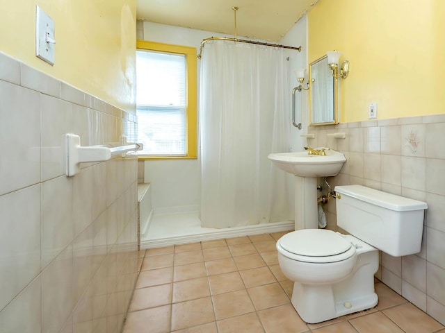 3 3rd St, Glenwood Landing, NY 11547 - bathroom with tile walls, toilet, tile patterned floors, a shower with shower curtain, and wainscoting