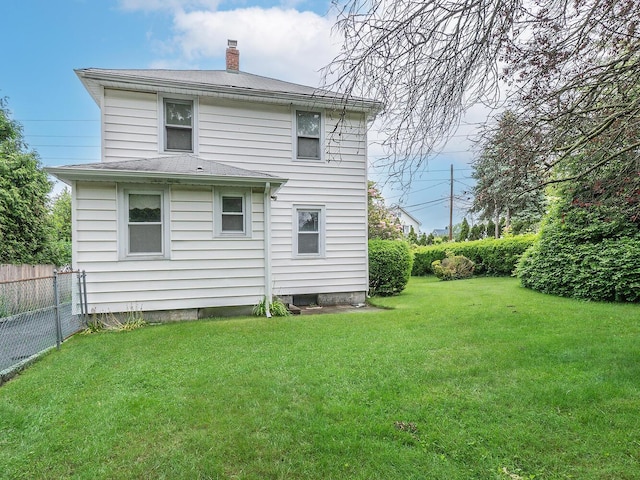 3 3rd St, Glenwood Landing, NY 11547 - back of house with a chimney
